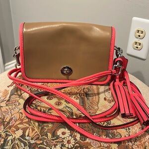 Coach tan crossbody with hot pink lining and double crossbody strap